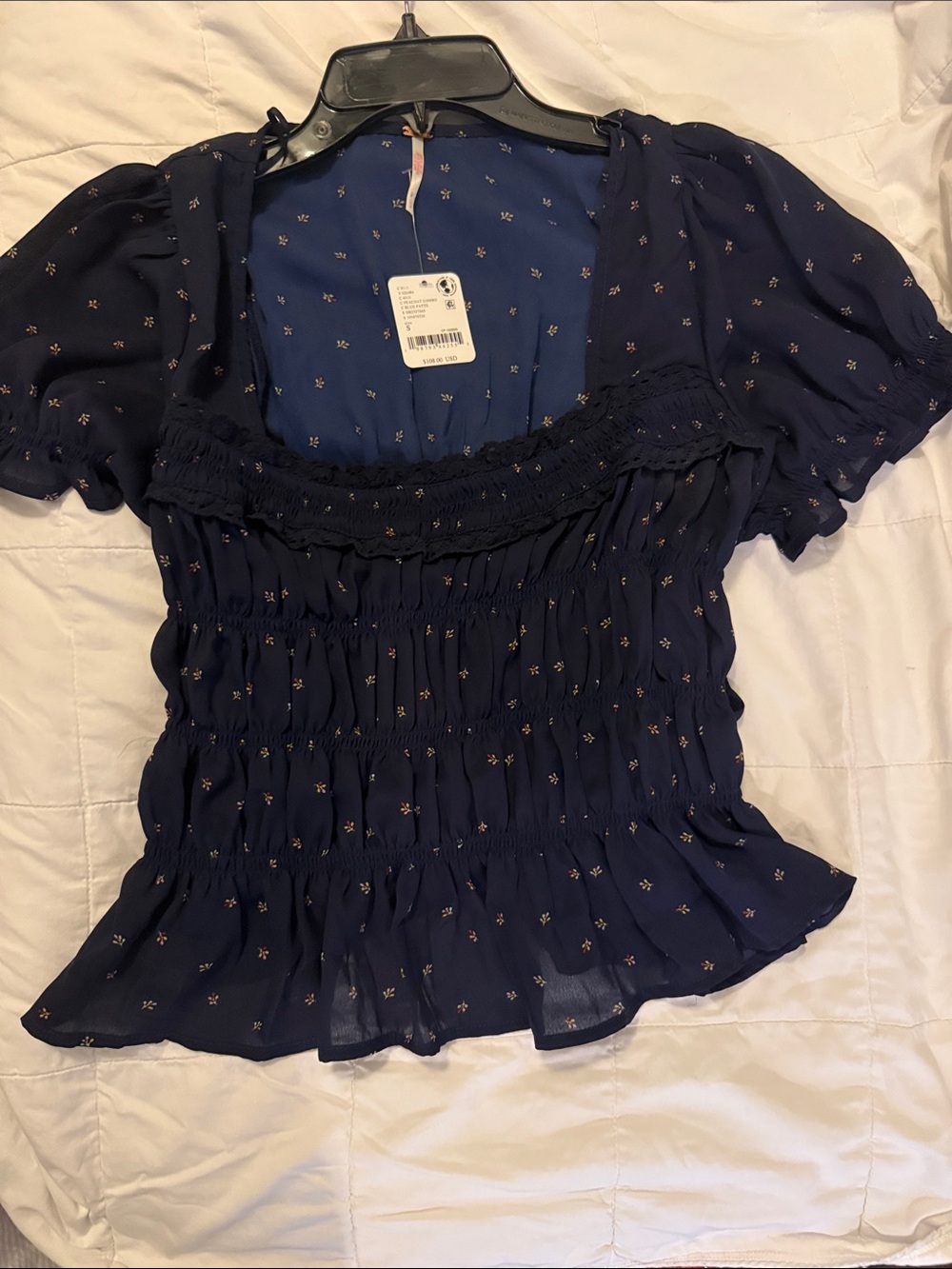Free People Navy with tiny flowers, ties in back.